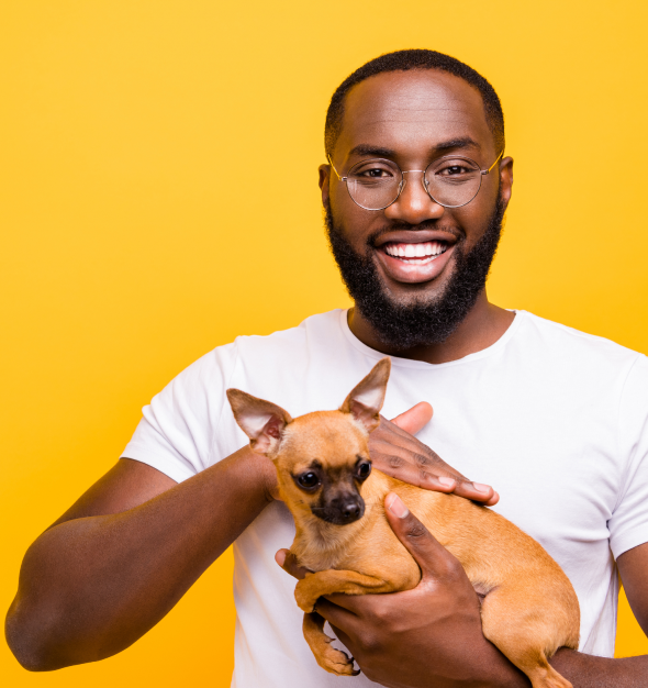 Man holding small dog